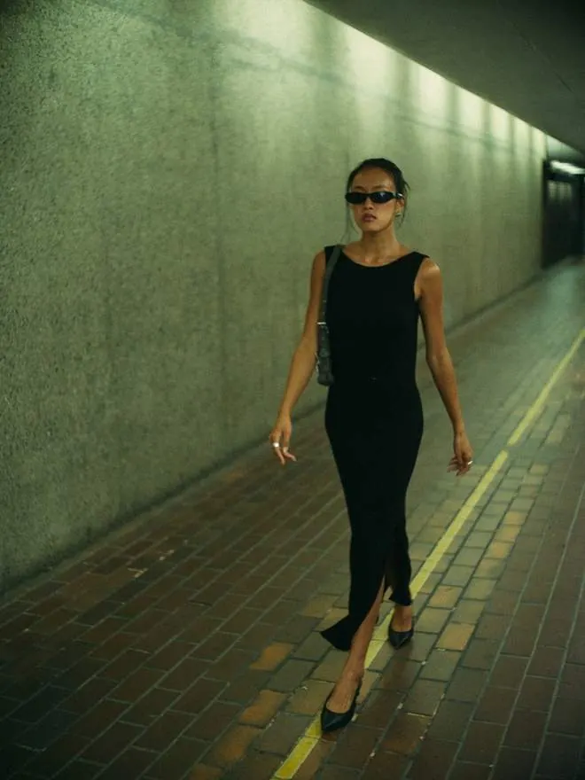 Walking a green-lit tunnel
